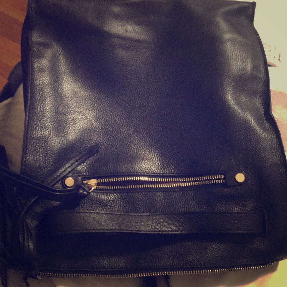 A black leather backpack/handbag